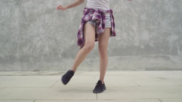 Asian backpacker blogger woman feeling happy dancing on street while traveling alt