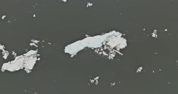 Ice Small Flows Breaking Up in the Early Spring on the River alt