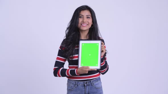 Happy Young Beautiful Persian Woman Showing Digital Tablet alt