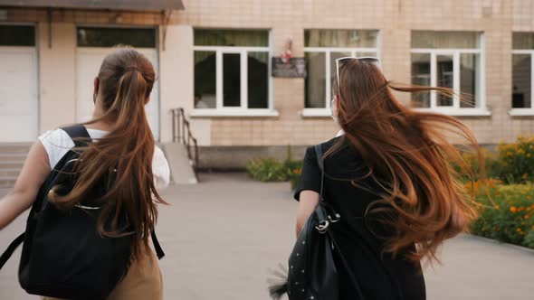 Schoolchildren with Face Masks Running To School, Rear View alt