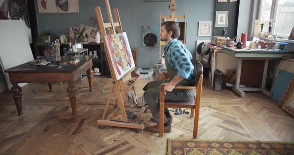 Male Artist Working in Studio