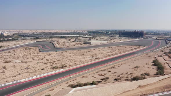 Aerial view of Dubai Autodrome race track, wavy corners, turns