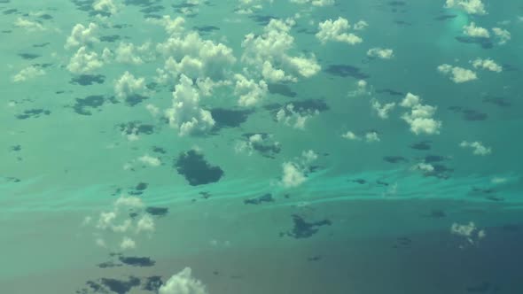 Flying over The Bahamas. Beautiful ocean colors. Actual aerial footage.