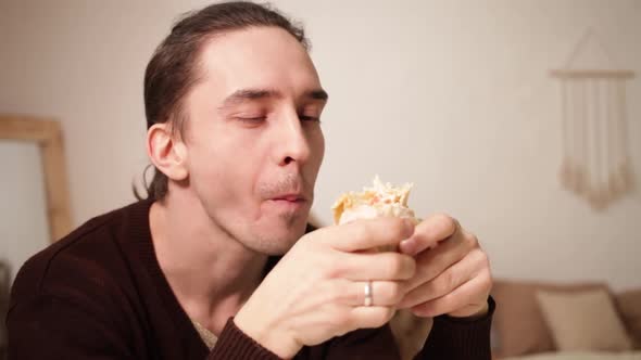A Man Eats and Enjoys Food