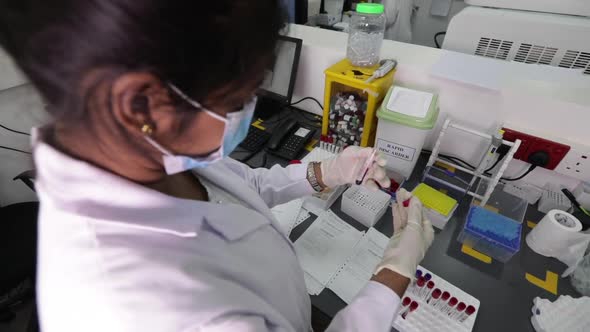 Indian Scientist Blood Testing Testubes 3