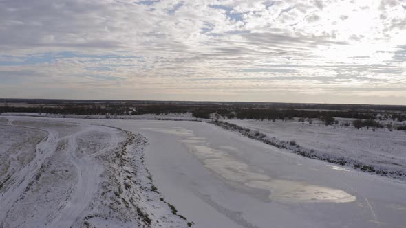 Aerial Footage of an Ice Covered River on a Winter Day