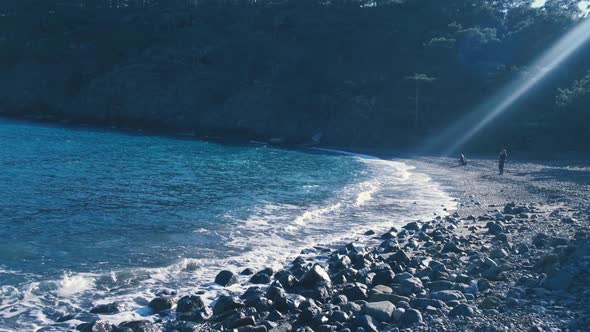 Beach Sea Stones and Small Mountain