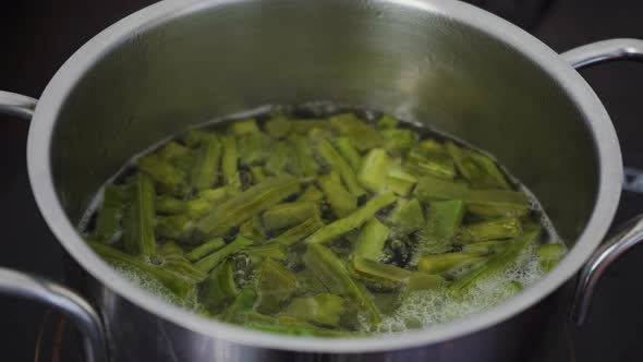 Cactus food gently simmering in boiling water cooking. A traditional native Mexican dish and street alt