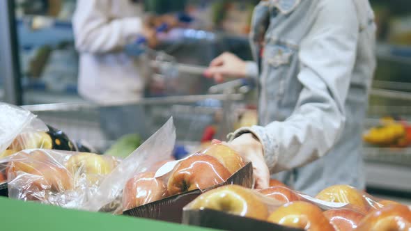 Supermarket Fruits are Getting Picked Up Buy a Woman alt