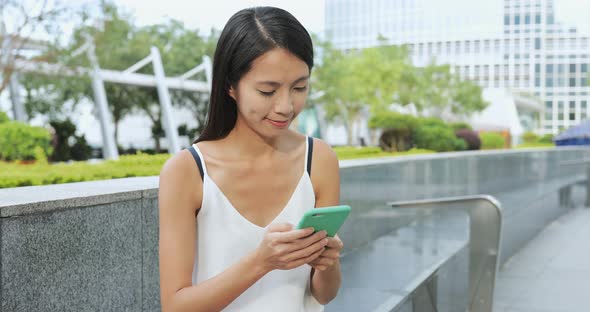 Woman use of smart phone in the evening  alt