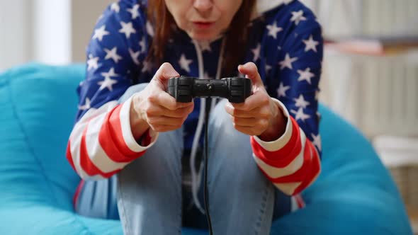 Unrecognizable Female Retiree Gaming Online Pressing Game Controller alt
