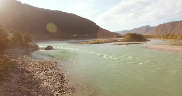 Low Altitude Flight Over Fresh Fast Mountain River with Rocks at Sunny Summer Morning alt