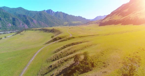 Aerial Rural Mountain Road and Meadow at Sunny Summer Morning alt