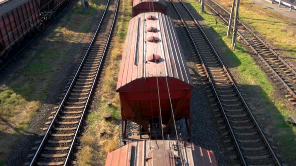 Container Freight Train with Many Cargo Wagons Transporting alt
