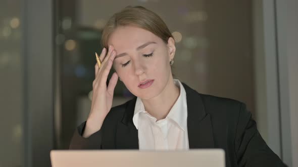 Close Up of Businesswoman Having Headache in Office at Night alt