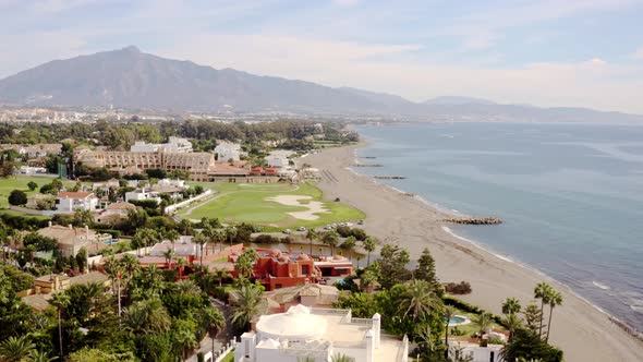 costa del sol coastline with resorts and a golf course alt