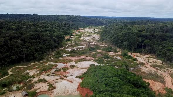Aerial footage over the huge gold mine on the amazon. alt