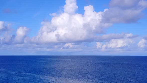 Aerial travel of seashore beach by blue water and sand background alt