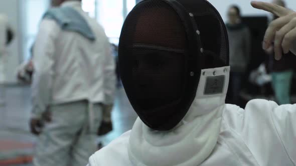 Fencing. Fencer During a Duel. Slow Motion. Kyiv. Ukraine alt