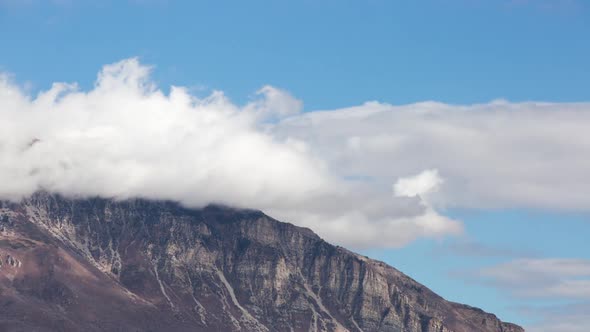 Time lapse of mountain top as clouds move by