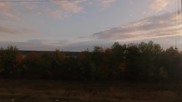 View From the Train Window at Sunset Time in Autumn