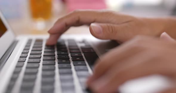 Working on laptop computer alt