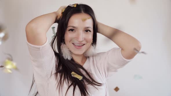 Gorgeous Brunette Lady with Star Earrings Dancing in Sunlight