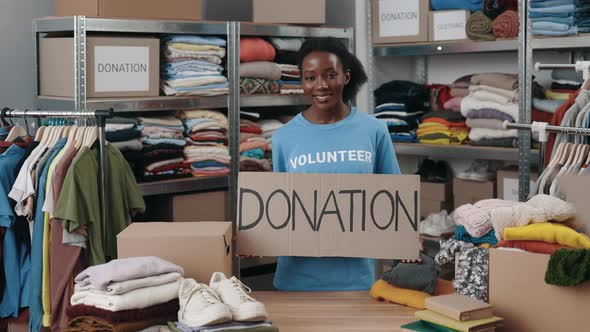 Portrait of Energetic Multiracial Woman Looking at the Camera and Smiling While Holding Banner with alt