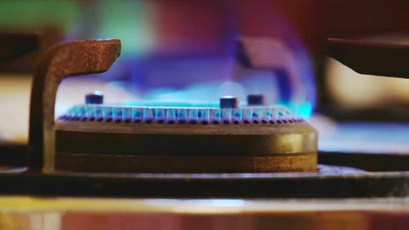 Gas Fire Burns And Heating Up The Frying Pan On The Stove