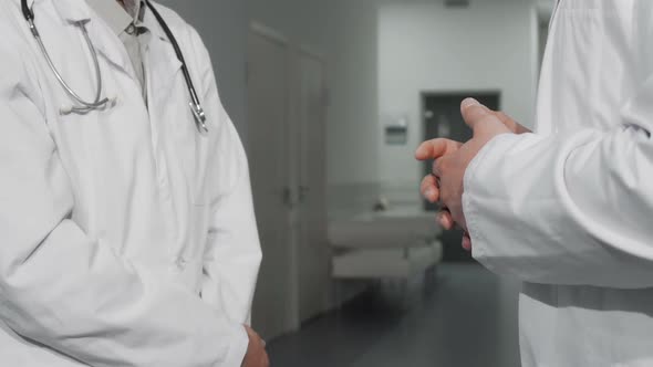 Unrecognizable Doctors Shaking Hands at the Hospital