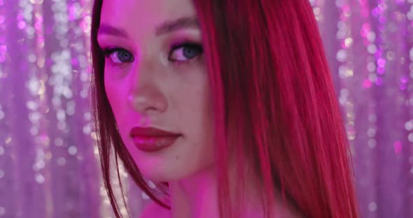 Glamour Girl with Perfect Makeup in Pink Light alt