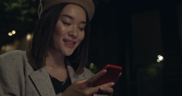Bottom View of Happy Female Person Using Smartphone and Scrolling Social Media While Walking at alt