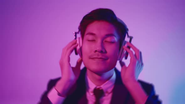 portrait studio rgb color concept yound smart asian businessman wear formal suit wear headphone