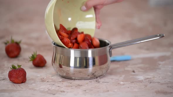 Putting the Strawberries and Sugar Into Saucepan