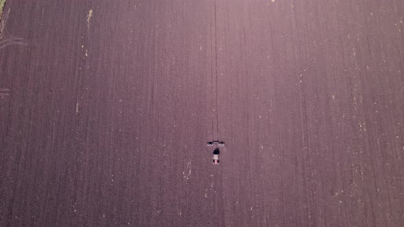 Tractor Preparing Soil for Planting New Crop Next Season alt