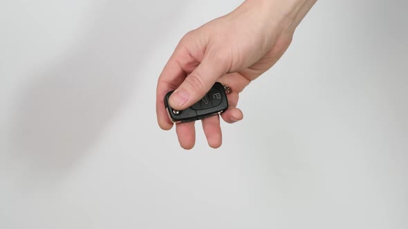 Hand passes the car key to another person. Close up.HD
