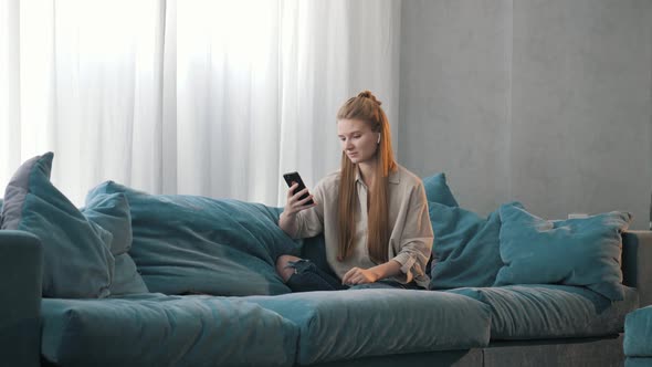 Portrait of Happy Business Woman Enjoy Success on Mobile Phone at Home Office.