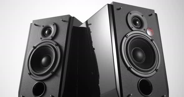 Music Speakers with Vibrating Bass Woofer Slowly Turning Around alt