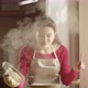 Housewife With A Steaming Pan And A Ladle Cooking And Smelling Delicious Soup Smiling At Camera - VideoHive Item for Sale