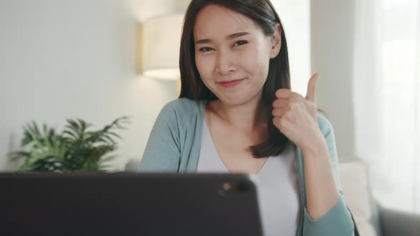 Beautiful Asian Woman Showing Thumb up Sign