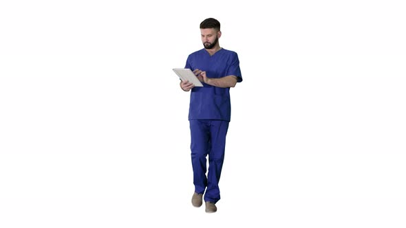 Confident Concentrated Focused Surgeon Using Digital Tablet on White Background alt