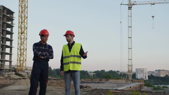 Two Men Discuss Their Modern House Buiding alt