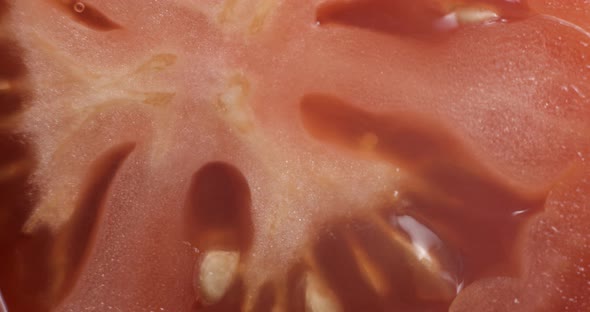 Sliced tomato rotating close up