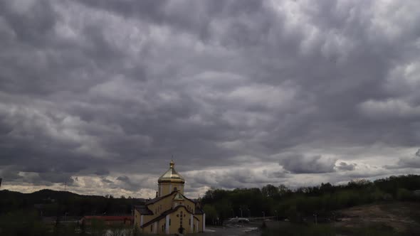 Time lapse: the sun hidden behind fluffy clouds flying in the sky.