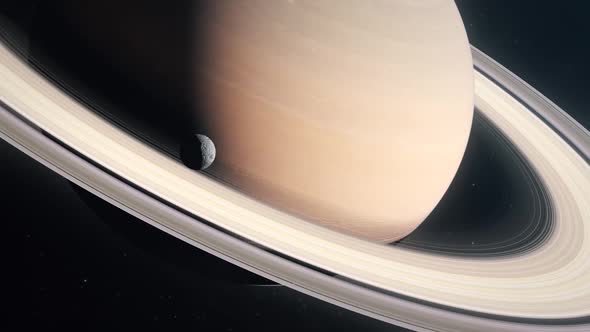 The Moon Mimas Orbiting the Gas Giant Planet of Saturn