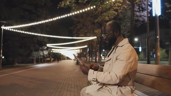 Black Man Using Digital Tablet alt