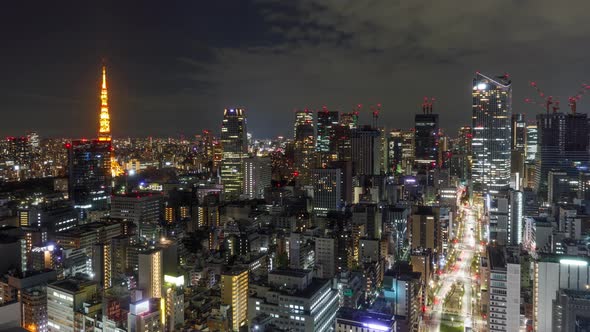 Time Lapse of the densely packed Tokyo Japan skyline shot at night alt