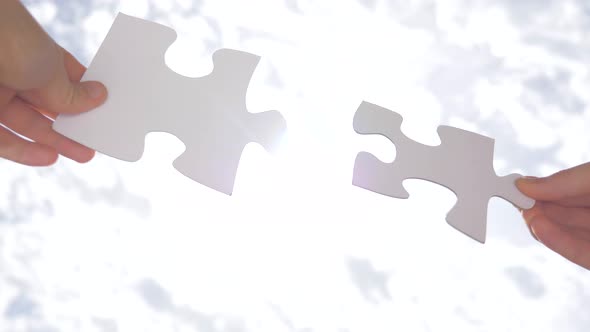 Psychology of Relationships. Logic, Interconnection, Teamwork. Puzzle Pieces Connected. Hand