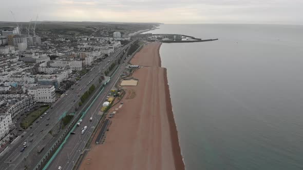Aerial footage of Brighton and Hove town centre beach and coastal area showing the Brighton Marina alt