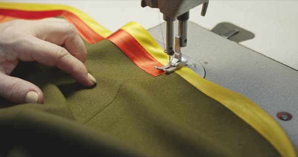 Woman Seamstress Working on an Industrial Sewing Machine.